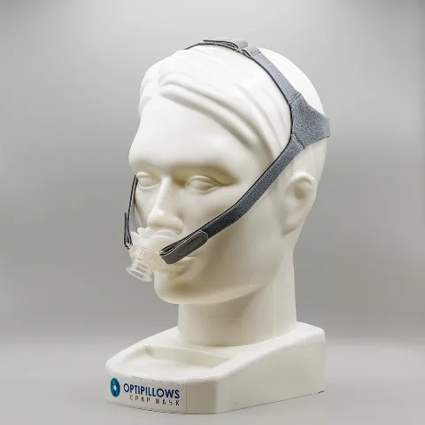 Opti+ MiniPAP mask worn on a model — the OptiPillows EPAP nasal-pillow mask with headgear