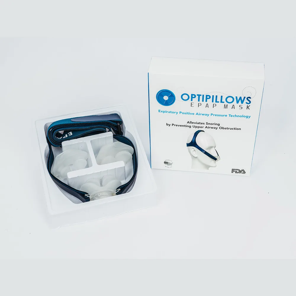 What arrives: the OptiPillows kit in its tray beside the retail box