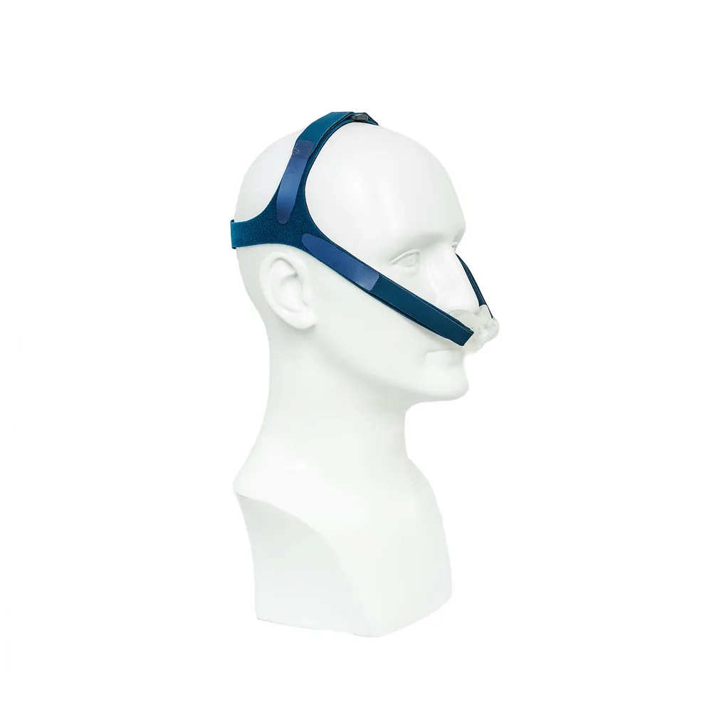 The OptiPillows EPAP mask worn, showing how the nasal pillows and headgear sit